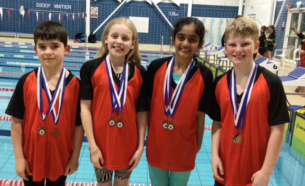 Swim team with medals